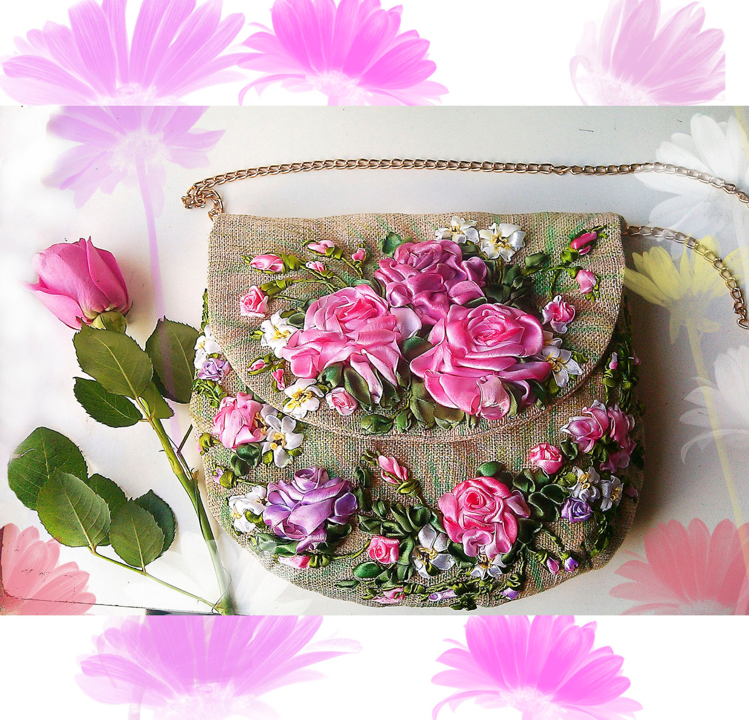 A tan purse with pink and purple flowers embroidered on the front